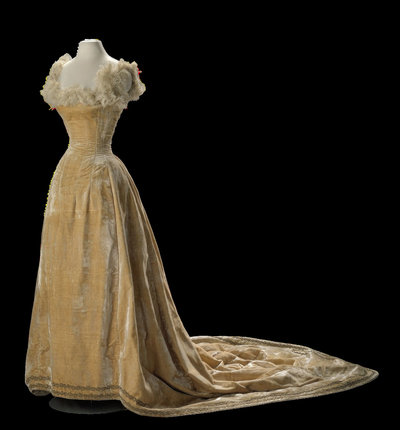 Yellow velvet ball gown from c. 1895, with  gold braid and ostrich feathers from the collection of the Amsterdam Museum