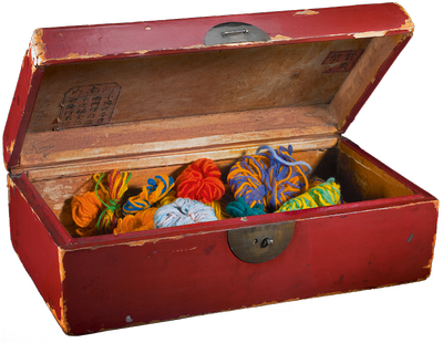  Box with colored balls of wool.
