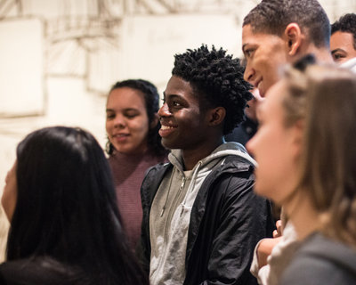 Young adults smiling in the museum galleries. Photo: Pepijn Nuiten