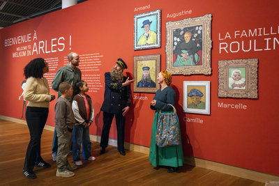 Two actors playing postman Roulin and his wife Augustine take a family on a tour along the Van Gogh and Roulin exhibition at the Van Gogh Museum. Photo: Anke van der Meer
