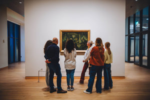 Visitors are looking at the painting The Potato Eaters by Vincent van Gogh during a guided tour t the van Gogh Museum. Photo: Jelle Draper