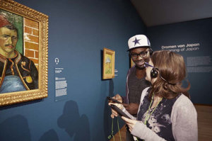Museum visitors with Multimedia Guide, photo by Maaike Koning 